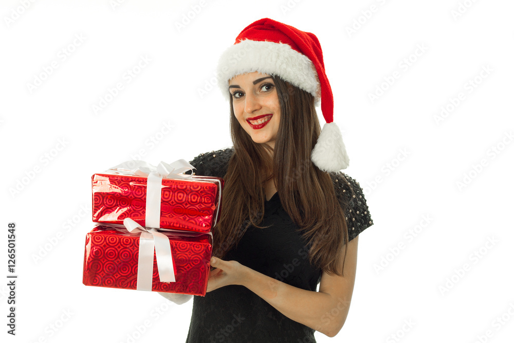 Pretty girl in santa hat with red gift Pretty girl in santa hat with red gift