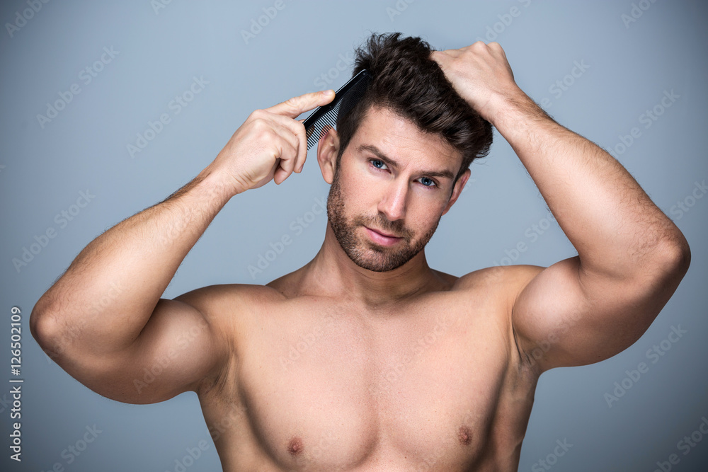 Man combing his hair
Man combing his hair