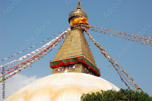 Bodnath stupa with Buddha eyes and prayer flags in Kathmandu, Nepal
