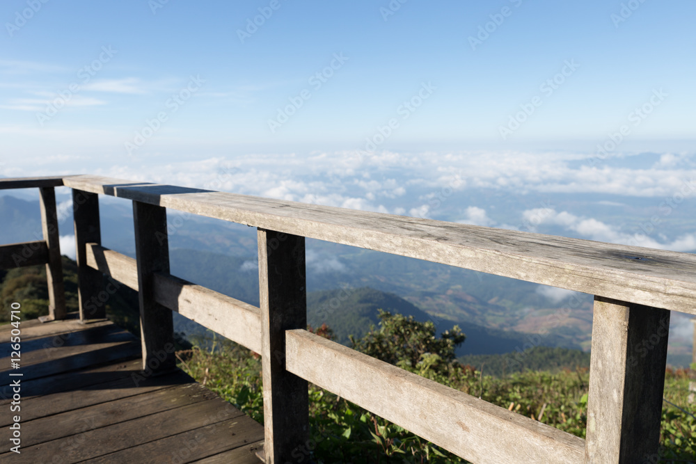 Obraz premium wood balcony with mountain view in morning