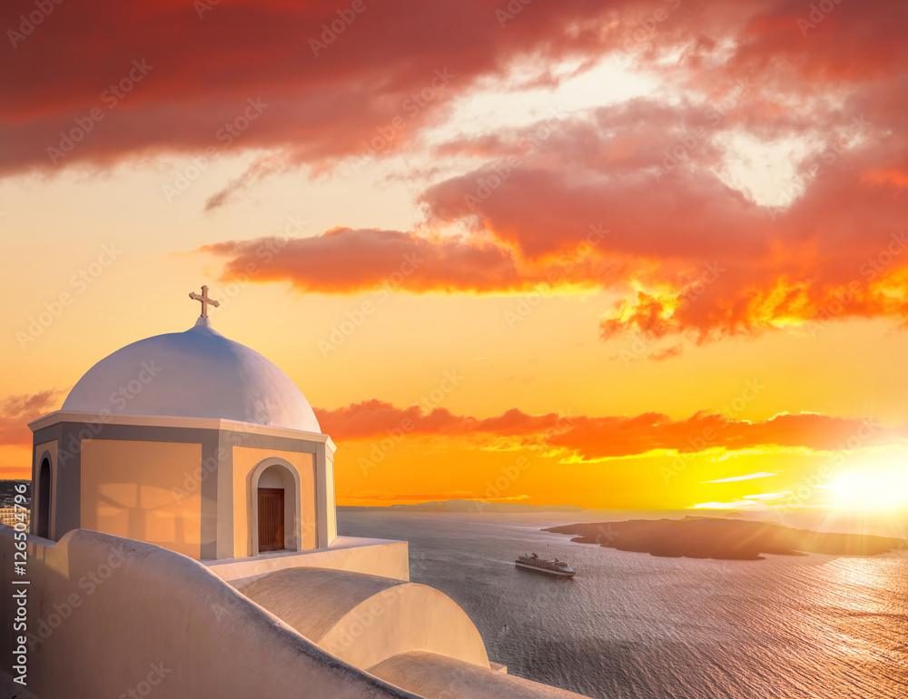 Old Town of Thira on the island Santorini, white church against colorful sunset in Greece - obrazy, fototapety, plakaty 