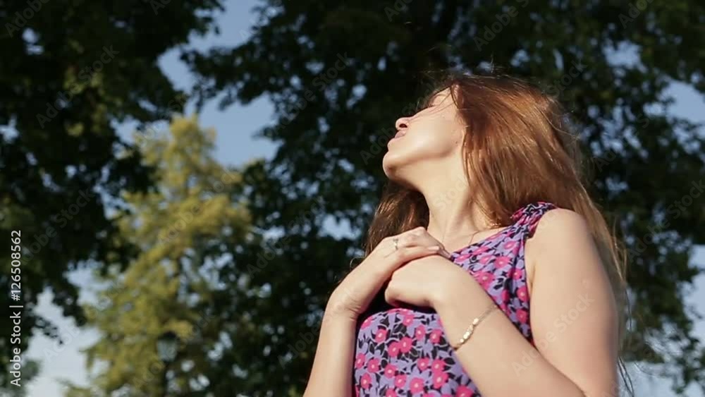 Portrait of a lady. She's enjoying the lovely summer weather. Portrait of a lady. She's enjoying the lovely summer weather.