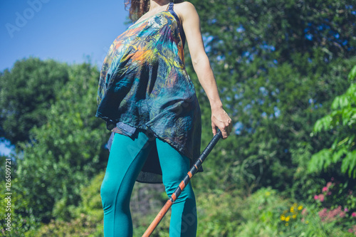 Canvas Print Young woman playing croquet