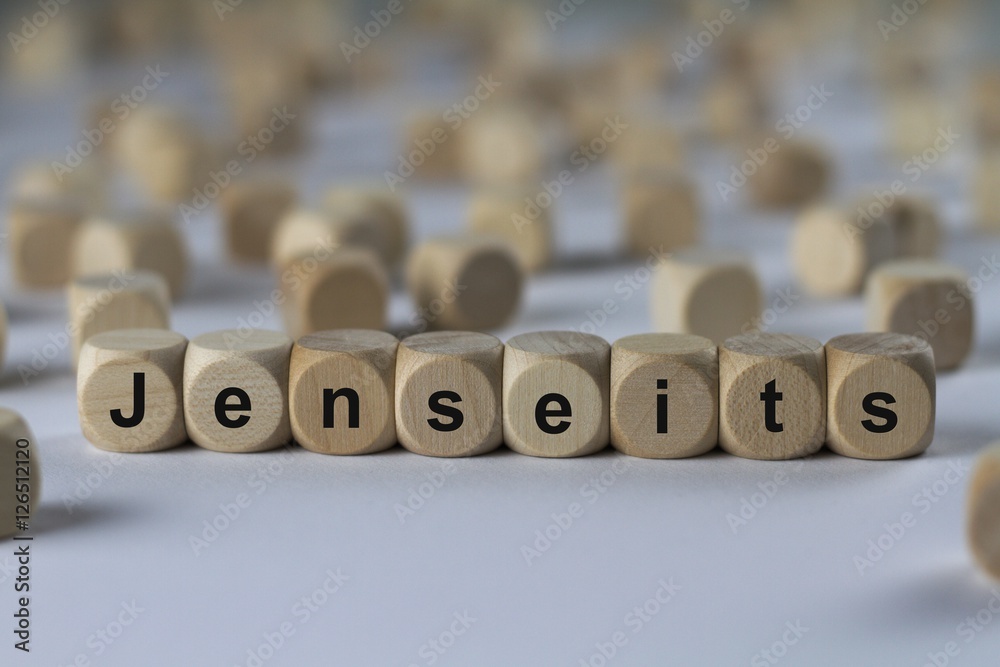 Fototapeta premium Jenseits - Holzwürfel mit Buchstaben