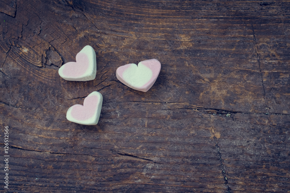 Fototapeta premium Heart marshmallow on wooden background