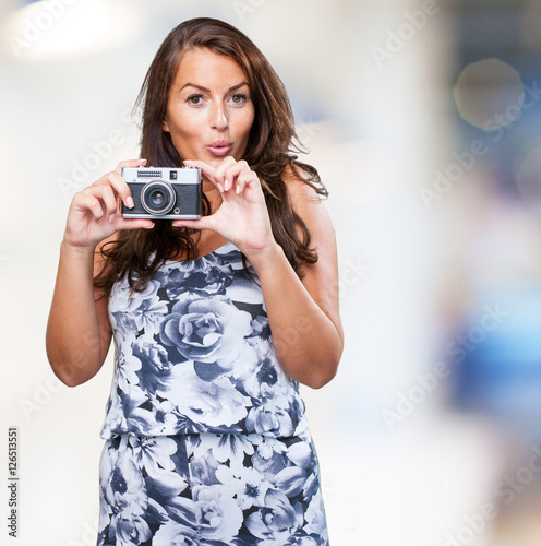 pretty woman holding a camera