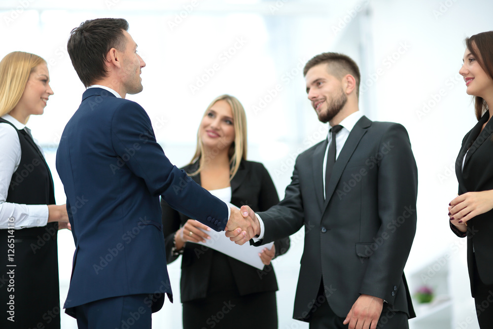 Handshake to seal a deal after a job recruitment meeting in a of Handshake to seal a deal after a job recruitment meeting in a of