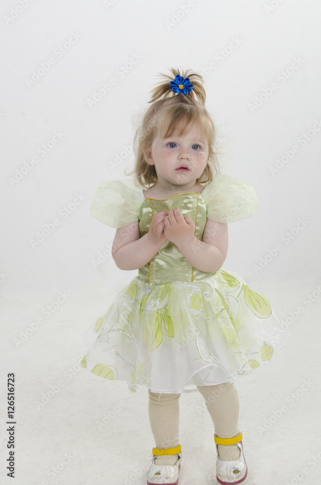 The child, a little girl posing in studio. Carefree childhood. The development and education of preschool children. The child, a little girl posing in studio. Carefree childhood. The development and education of preschool children.