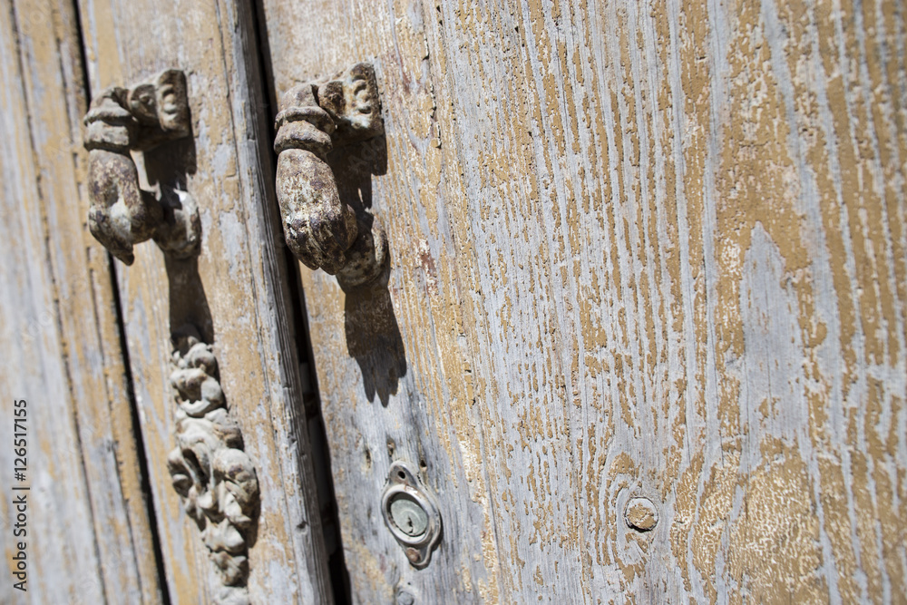 antique rusty lock in wooden door
