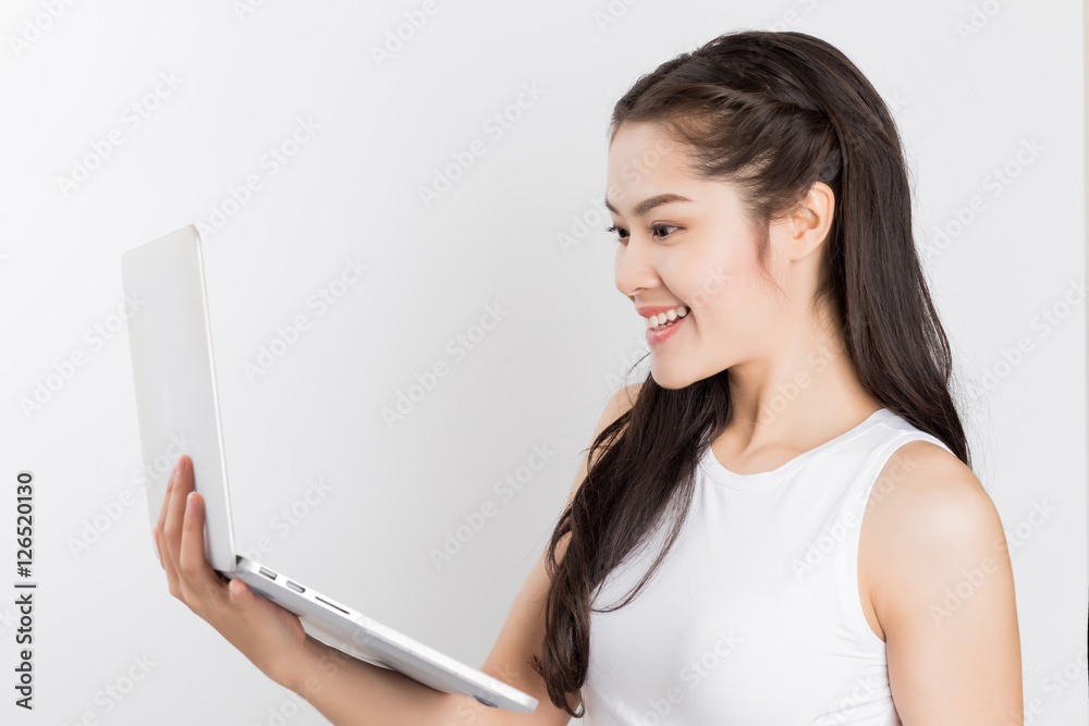 Young happy Asian woman with laptop, happy smiley face student w Young happy Asian woman with laptop, happy smiley face student w
