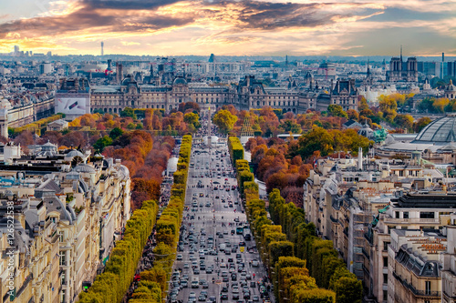 Paris, France - Champs Elysees cityscape. View from Arc de Triomphe. Blue sky with clouds in autumn