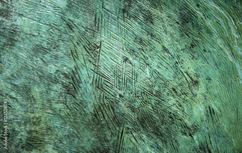 Patina textured bronze detail.