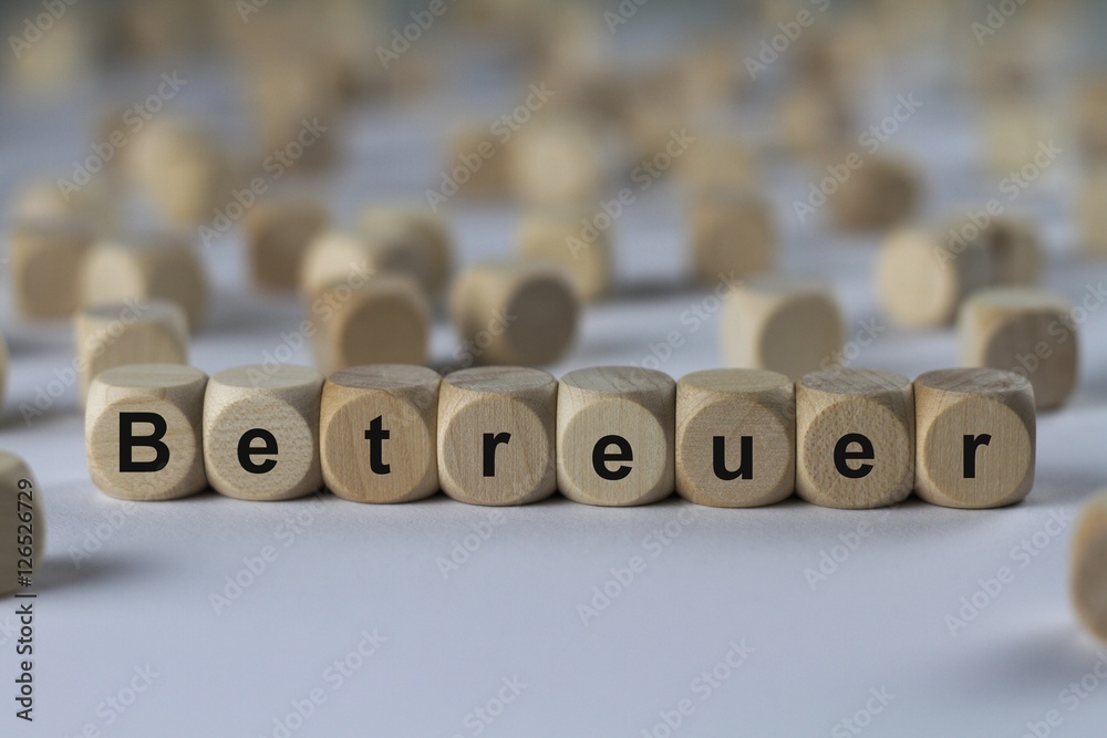 Obraz premium Betreuer - Holzwürfel mit Buchstaben