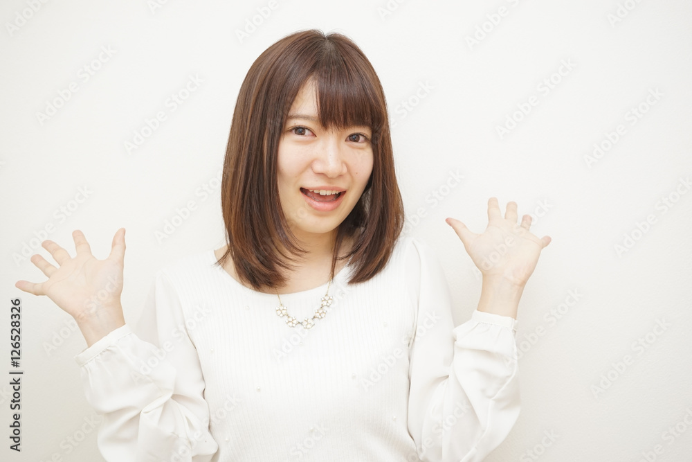 Young woman treating her hair on the white background Young woman treating her hair on the white background