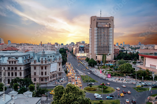 Traffic in the center of the capital city of Romania, Bucharest at dusk.