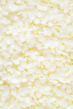 white cosmetic beeswax pellets background.
