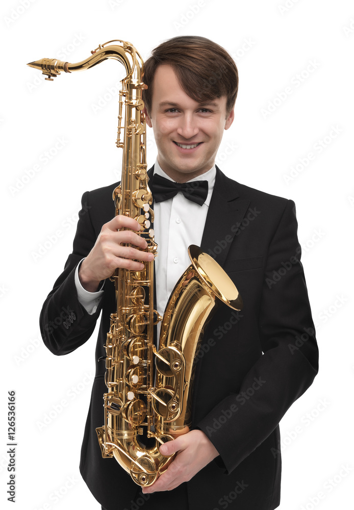 Fototapeta premium Attractive saxophonist with a saxophone in suit.