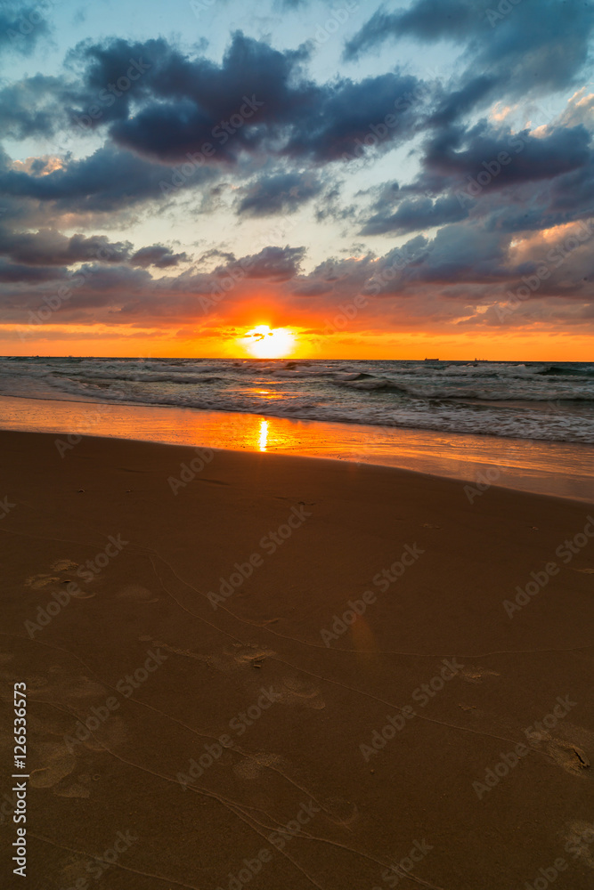 sea waves on the sunset background