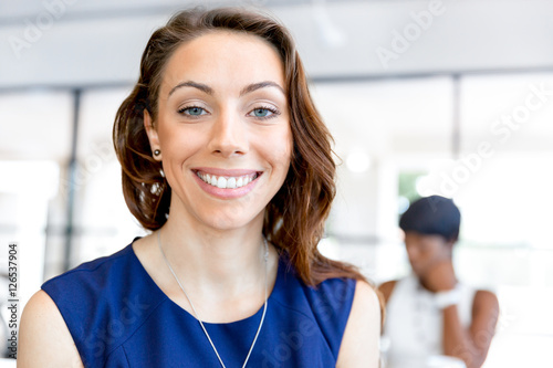 Young businesswoman sitting at desk and working