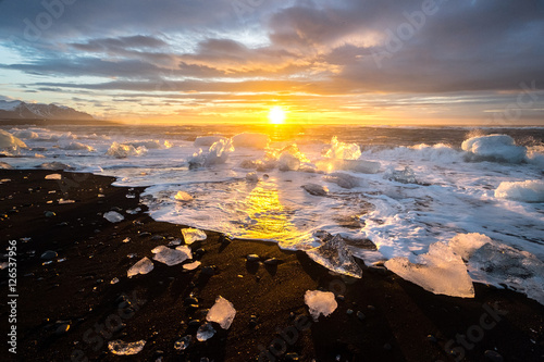 Ices on the beach at jokulsarlon - southeast Iceland photo