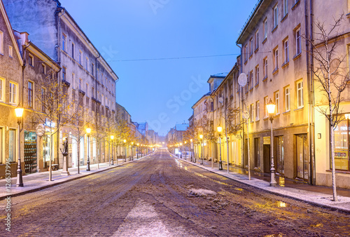 Empty snowy cobblestone street. Old Town district. Klaipeda, Lithuania.