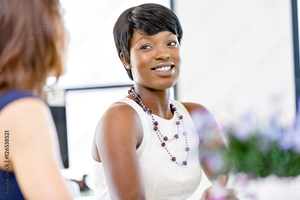 Fototapeta premium Women working together, office interior