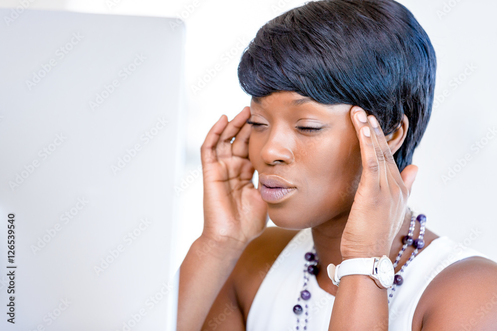 Young businesswoman sitting at desk and working Young businesswoman sitting at desk and working