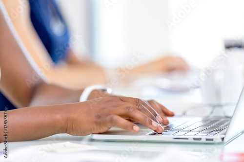 Image of woman's hands typing
