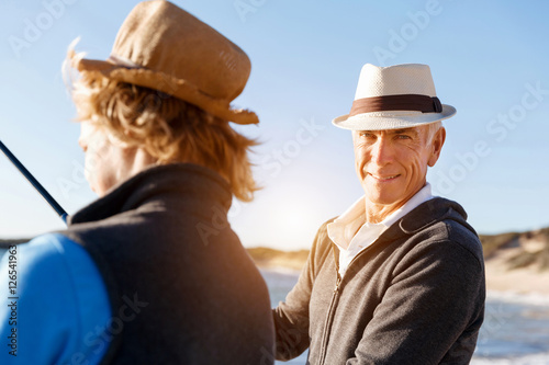 Senior man fishing with his grandson © Sergey Nivens