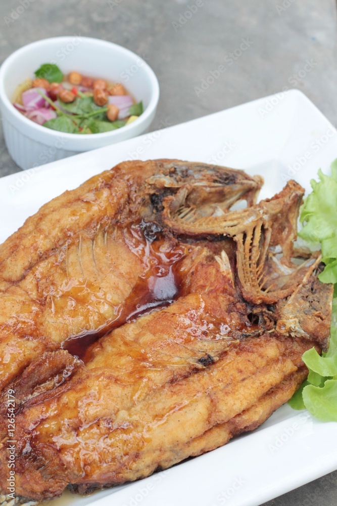 Fried snapper with fish sauce and spicy salad. Fried snapper with fish sauce and spicy salad.