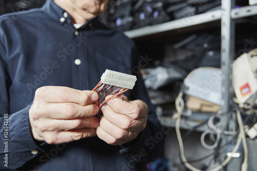 Man holding motherboard connector