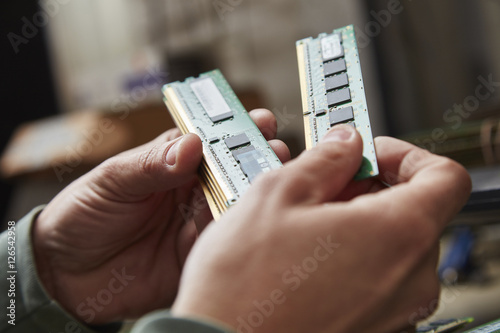 Hand holding used RAM photo