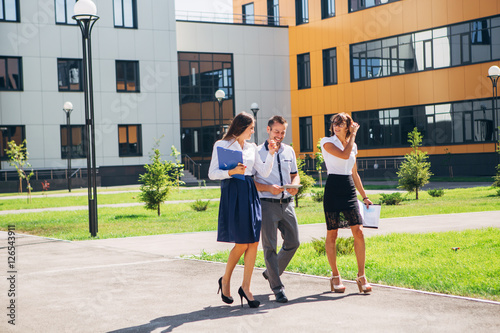 three colleagues discussing work in an innovative town