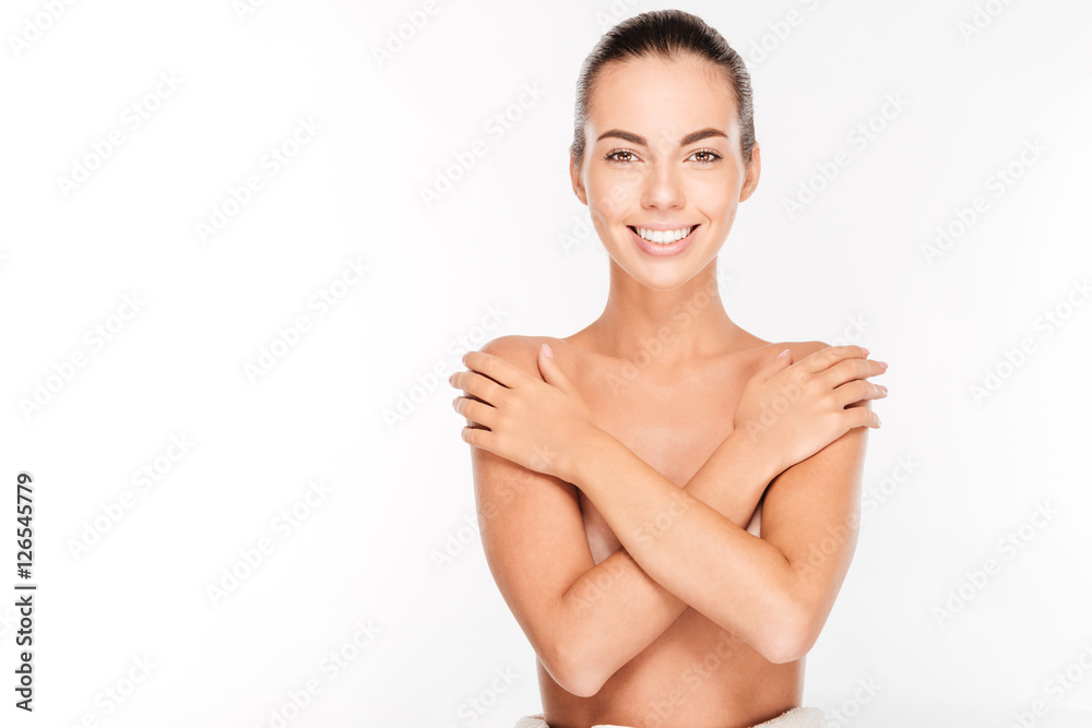 Beautiful young nude woman with arms crossed on her chest Beautiful young nude woman with arms crossed on her chest
