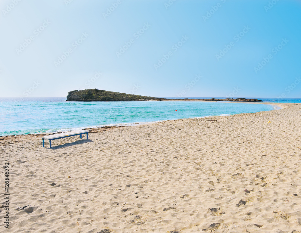 Fototapeta premium Lonely sea coast. Island surrounding deep blie water