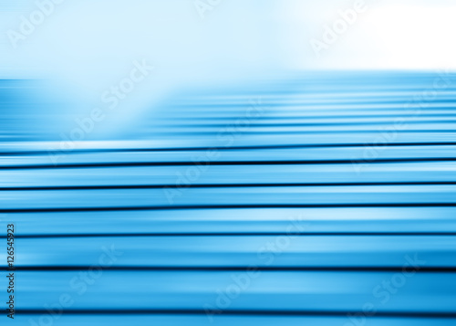 Horizontal motion blur blue stairs background