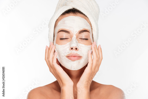 Murais de parede Woman with eyes closed and white facial mask on face