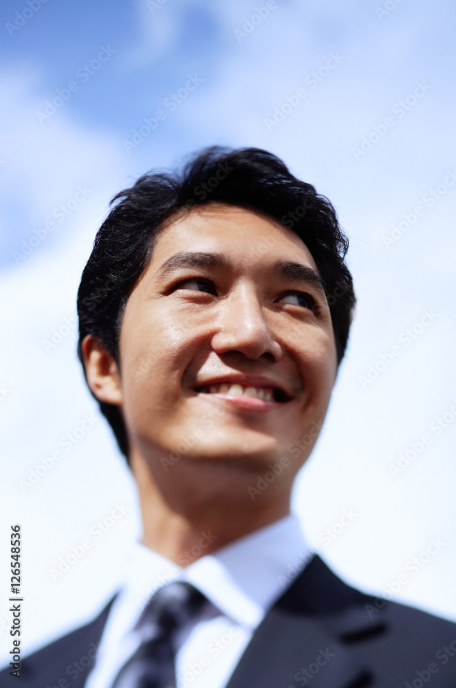 Businessman, looking away, smiling, head shot Businessman, looking away, smiling, head shot