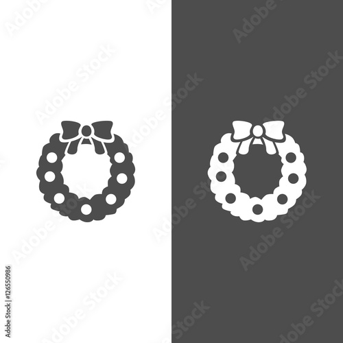 Icono de una corona de Navidad o guirnalda sobre fondo blanco y negro