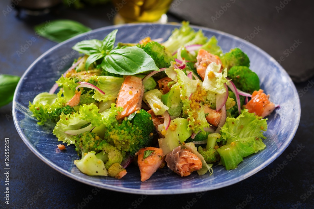 Salad of stewed fish salmon, broccoli, lettuce and dressing. Fish menu. Dietary menu. Seafood - salmon. Salad of stewed fish salmon, broccoli, lettuce and dressing. Fish menu. Dietary menu. Seafood - salmon.