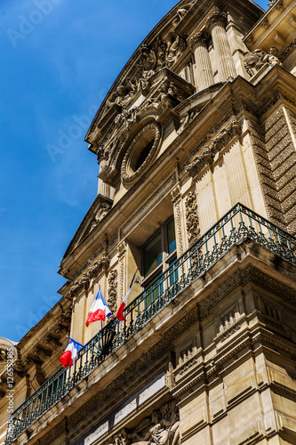 Three France flags on building