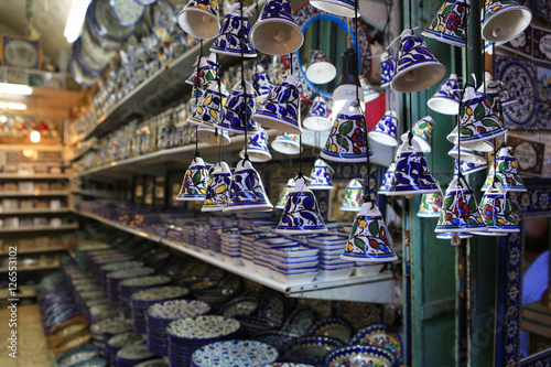 Ceramic plates and other souvenirs for sale located on Arab baazar inside the walls of the Old City of Jerusalem