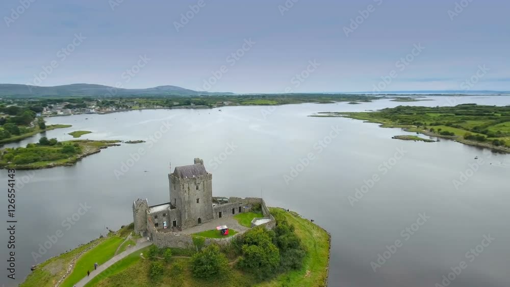 Amazing aerial shot of the Dunguaire castle the castle located near the shore in West Irealand Amazing aerial shot of the Dunguaire castle the castle located near the shore in West Irealand