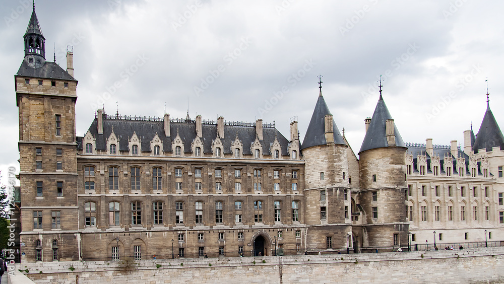 Castle Conciergerie - former royal palace and prison. Conciergerie located on the west of the Cite Island View from the other side of the river Seine
