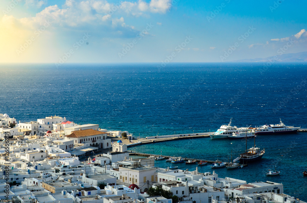 Top view of Mykonos island with Aegeon sea and blue sky