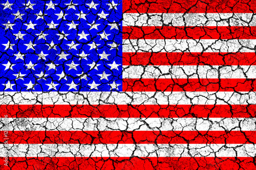 Flag of USA painted on cracked wall. Political concept. Old texture. Vintage design. USA flag on cracked earth. Famine and drought. Natural disaster. Front view.