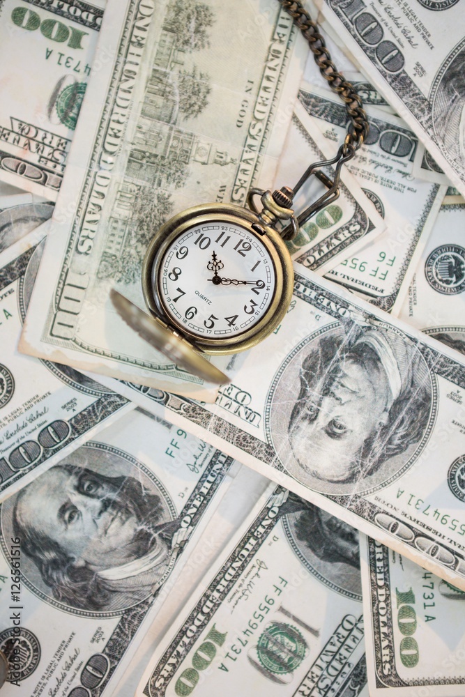 Pocket clock on one hundred dollar bills Pocket clock on one hundred dollar bills
