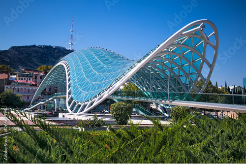 Bridge of Peace over the Kura River in Tbilisi , Georgia photo