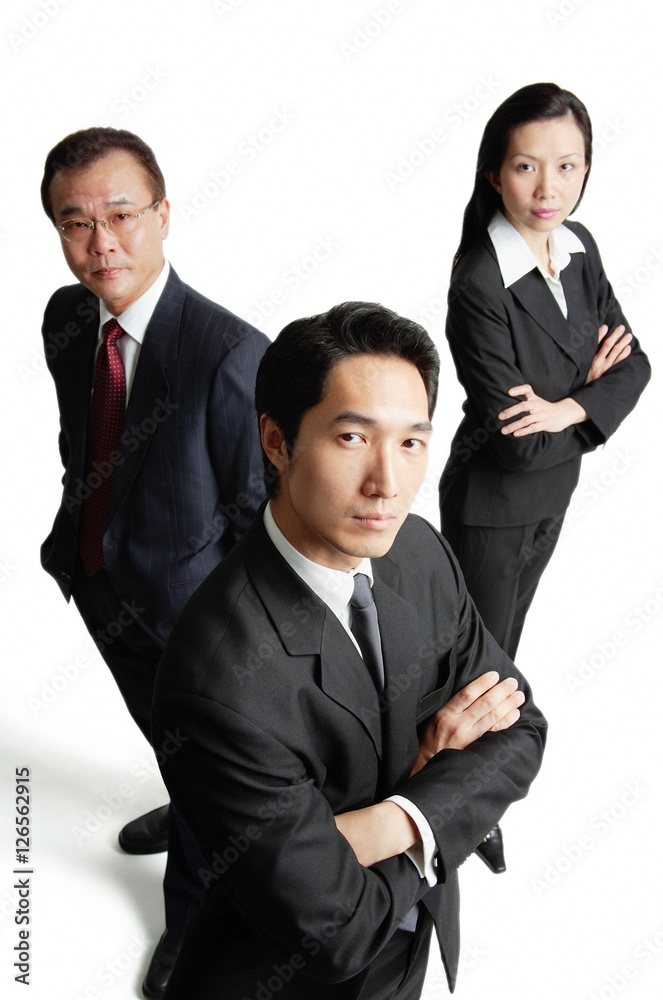 Executives looking at camera, serious expressions Executives looking at camera, serious expressions