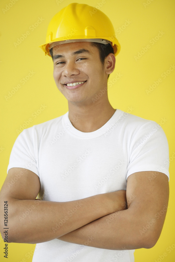 Man wearing hardhat, smiling at camera
